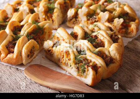 Slices of pie with minced meat and vegetables close-up on the table. horizontal Stock Photo