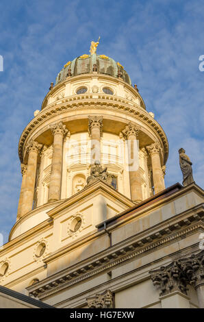 View on French Cathedral at Gendarmenmarkt square in golden afternoon light, Berlin, Germany