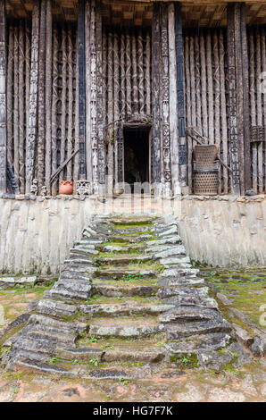 Stairs leading to entrance of wood and bamboo Achum at traditional Fon's palace in Bafut, Cameroon, Africa Stock Photo