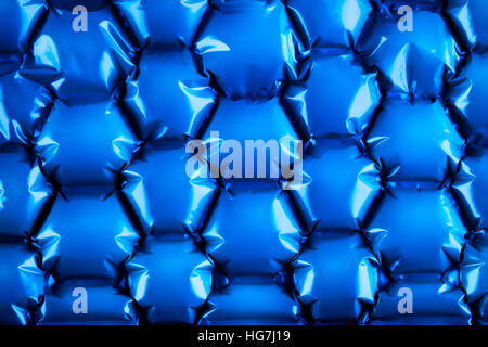 Hexagonal bubble texture background in electric blue showing shadows and relief. Stock Photo
