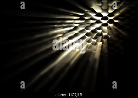 Light glinting though holes with light beams. Dark foreground Stock Photo