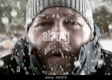 Man with winter clothing and face protection in extreme cold
