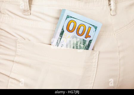 Heap banknotes of american dollars in the back jeans pocket Stock Photo