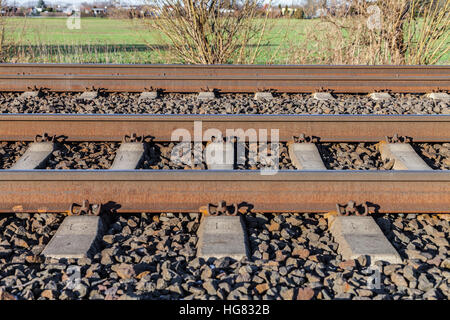 german rail road line lies on stones Stock Photo