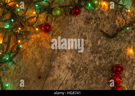 Christmas decoration with lighting, on an old wooden background Stock Photo