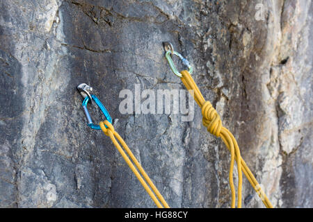 Ouray, Colorado - Ropes anchored on a rock wall protect ice climbers in Ouray Ice Park. Stock Photo
