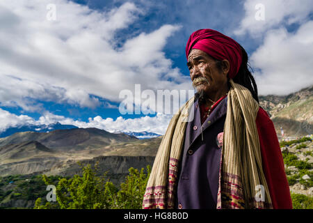 Portrait of Sadhu, holy man, looking into the himalayan mountains, Muktinath, Mustang District, Nepal Stock Photo