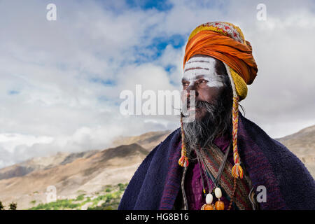 Portrait of Sadhu, holy man, looking into the himalayan mountains, Muktinath, Mustang District, Nepal Stock Photo