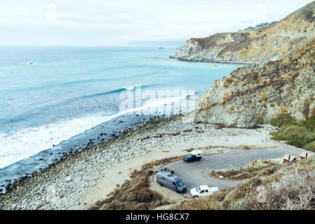 High angle view vehicles on winding road against sea Stock Photo