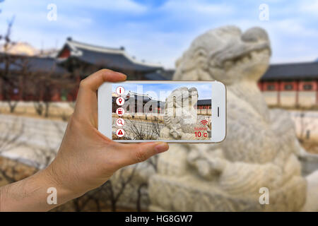Concept of traveling and tourism business using application of artificial intelligence, AI, and augmented reality, AR. Stock Photo