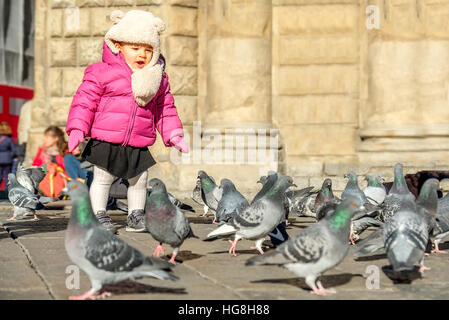 child play birds baby girl Stock Photo