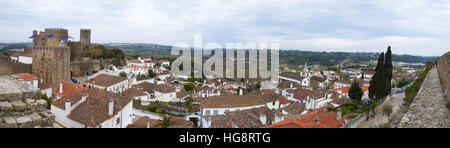 Portugal: the Castle and walls of Obidos with view of the roofs an palaces of the Old City Stock Photo