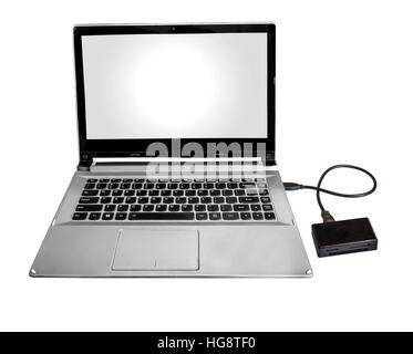 Micro SD and flash card reader connected with Laptop pc via data chord isolated in white. Stock Photo