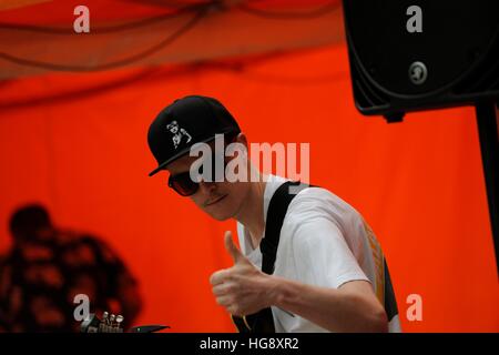 Rock guitarist on stage playing an Epiphone semi-acoustic at the Tramlines Festival Fringe, the Moor, Sheffield 2014 Stock Photo