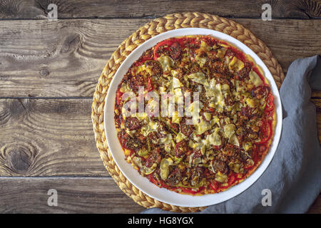 Preparing a pizza on a wooden table horizontal Stock Photo