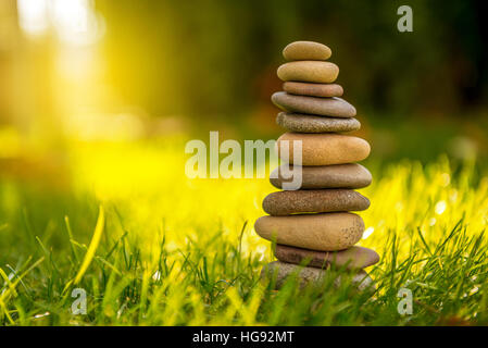 Stones Balance in sunset at sea in april Stock Photo