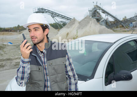 Man using walkie talkie Stock Photo