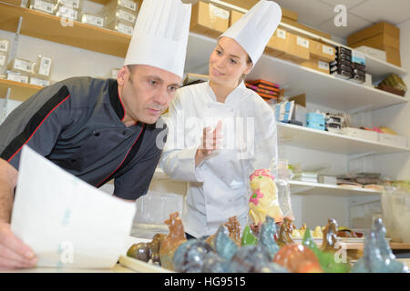 team of bakers in a commercial kitchen Stock Photo