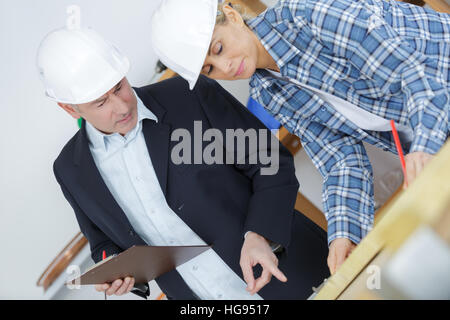 two workers wearing protective helmet Stock Photo