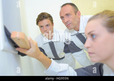 brushing the wall Stock Photo