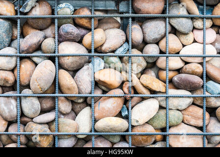 Meshed Metal and Rock Wall Background Stock Photo