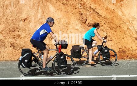 December 22, 2016- Chaing Mai, Thailand : Senior couple of cyclists riding bicycles on the road Stock Photo