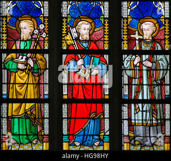 Stained Glass window depicting Saint Joseph, Saint Peter and St Francis Xavier in the Cathedral of Saint Bavo in Ghent, Flanders, Belgium. Stock Photo