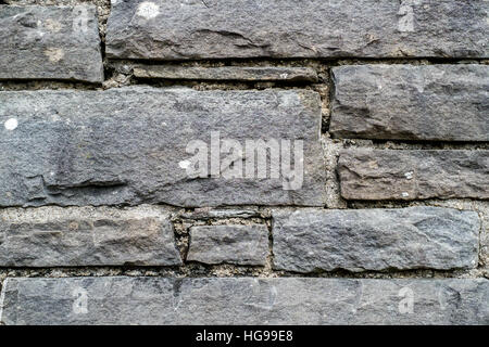 Close up of traditional sandstone wall with lichens Stock Photo