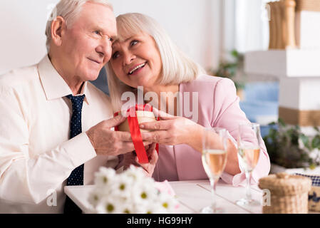 Two joyful senior people sharing a pleasant moment Stock Photo
