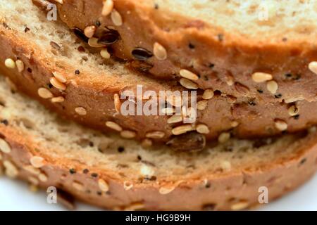 Slices of Warburtons Seeded Batch loaf five seed combination of linseed, millet, poppy, sunflower, and sesame. Stock Photo