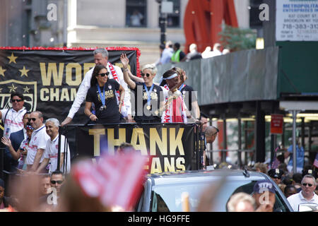 Carli Lloyd, Megan Rapinoe of the United States Women's Nation Team are honored with a ticker tape parade to commemorate their gold medal in the Women's World Cup, through the Canyon Of Heroes in NYC. Stock Photo