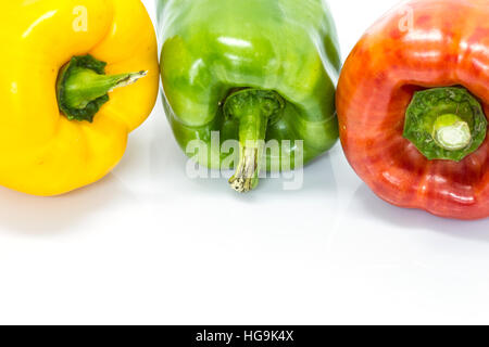 colored peppers over white background, Fresh vegetables sweet Peppers or Bell peppers Stock Photo