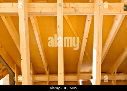 Indoor image of a wooden frame roof truss construction on a new house Stock Photo