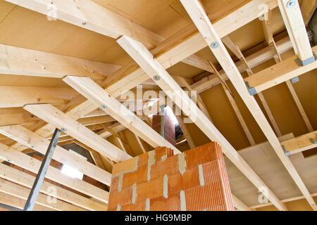 Indoor image of a wooden frame roof truss construction on a new house Stock Photo