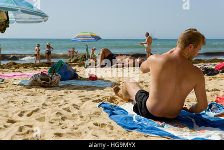 People at the famous beach of Olhos de Agua in Albufeira. Stock Photo