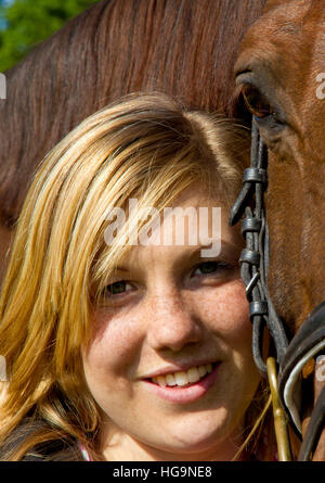 Portrait of a happy teenager with horse Stock Photo