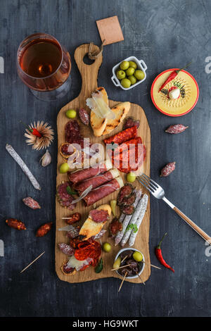 Tapas sausage mix from Spain jamon iberico lomo cheese ham chorizo olives Stock Photo