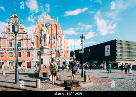 Riga, Latvia - July 1, 2016: Street Music Trio Band Of Three Young Musicians Guys Playing The Instruments For Donation On The Town Hall Square, Famous Stock Photo