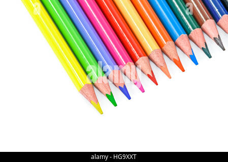 Colored pencils arranged by rainbow isolated on a white background Stock Photo