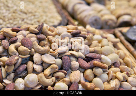 Different kinds of nuts in basket Stock Photo
