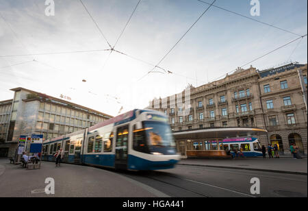 A tramway train is leaving the tram station at Zurich's Paradeplatz with headquarters of the Swiss banks UBS and Credit Suisse Stock Photo