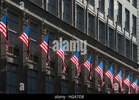 The flags on the front of Saks Fifth Avenue in Manhattan. Stock Photo
