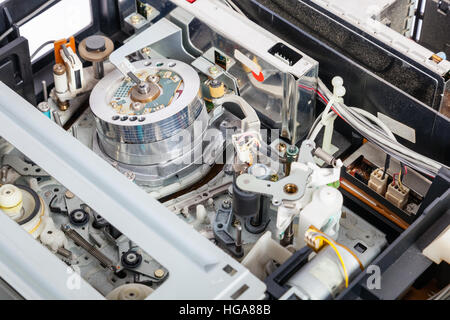 Interior of the mechanics of an old and obsolete VCR or Video Cassette Recorder Stock Photo