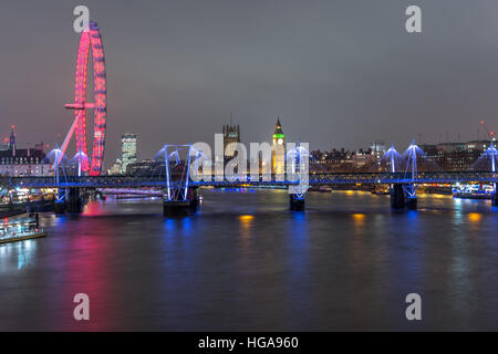 London skyline at night with embankment bridge, big ben and houses of parliament at the background, as seen from the waterloo br Stock Photo