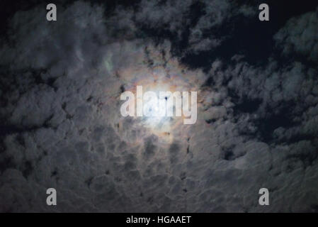 Night full moon bright clouds halo effect cloud sky mystery spooky lunar atmosphere weather Stock Photo