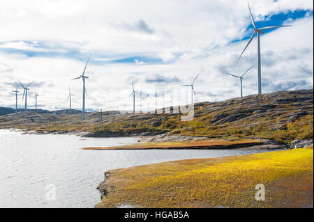 Wind turbines in a wind powered renewable energy production plant in barren landscape of north Norway Stock Photo