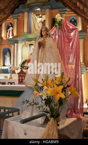Statue of Virgin Mary dressed for festival, Iglesia de San Pedro (San Pedro Church), San Pedro de Atacama, Norte Grande, Chile Stock Photo