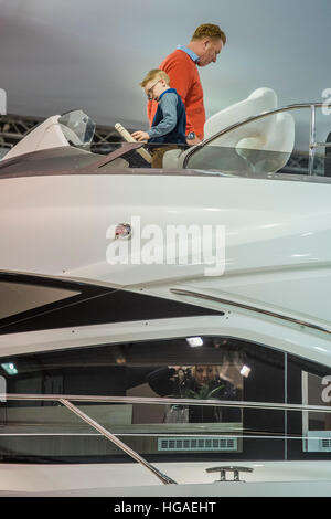 London, UK. 6th Jan, 2017. Potential buyers young and old browse the Sunseeker stand - The London Boat Show opens at the Excel centre. London 06 Jan 2017 © Guy Bell/Alamy Live News Stock Photo