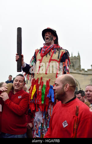 Haxey, Lincolnshire, UK. 6th Jan, 2017. The Haxey Hood is a 700-year old game, it took place today during a downpour. The Haxey fool is paraded around three pubs, singing chants and drinking free ale, burning of straw near village church behind the fool, then men and children do battle on a near by field.The Haxey Fool. © Ian Francis/Alamy Live News Stock Photo