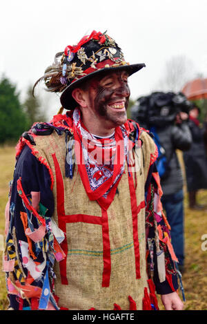 Haxey, Lincolnshire, UK. 6th Jan, 2017. The Haxey Hood is a 700-year old game, it took place today during a downpour. The Haxey fool is paraded around three pubs, singing chants and drinking free ale, burning of straw near village church behind the fool, then men and children do battle on a near by field.The Haxley Fool. © Ian Francis/Alamy Live News Stock Photo